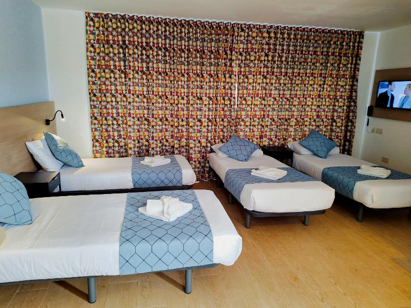Quarto com 4 camas individuais, ideal para grupos durante os cursos de inglês em malta.